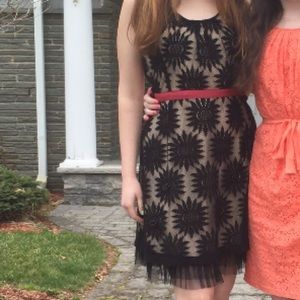 Black and beige lace dress with an open back